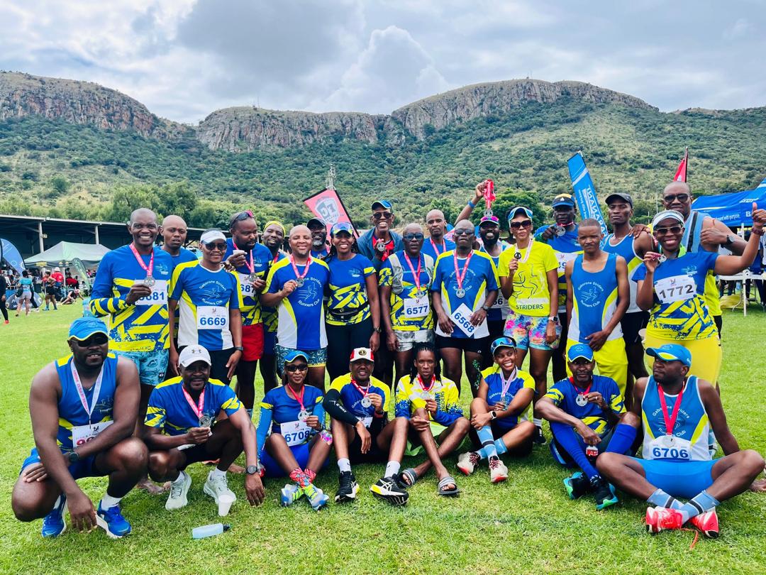 Gaborone Striders runners celebrating together